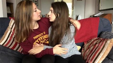 Mother and daughter playing with each other in the living room on the couch. . Girls first lesbian videos